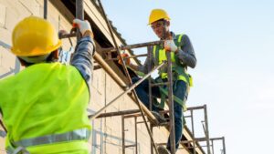 a picture of two construction workers in the working area